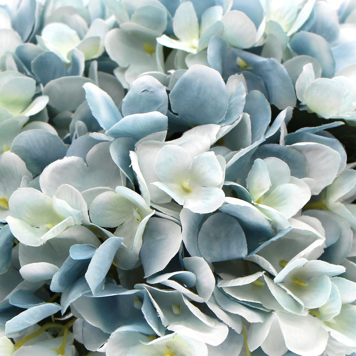 Premium Faux Hydrangea with densely layered soft blue and pale white petals, featuring delicate yellow-green centres