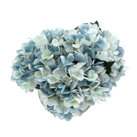 Premium Faux Hydrangea with dense pale blue and white fabric petals and dark green leaves in a rounded bloom