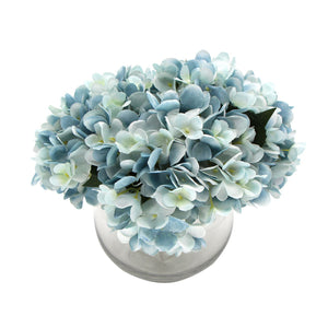 Premium Faux Hydrangea arrangement with pale blue and white petals in a clear rounded glass vase
