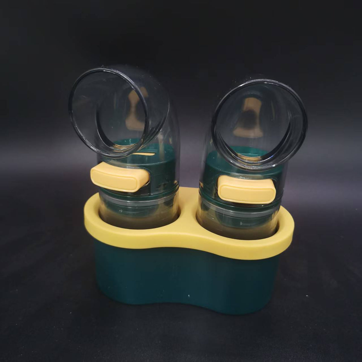 Quantitative Salt & Spice Dispenser Set with two dark green clear plastic shakers, yellow push buttons and matching storage base