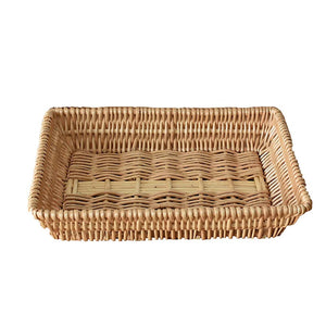 Rattan Storage Basket in natural woven rattan, rectangular with a low rim and tightly braided edges