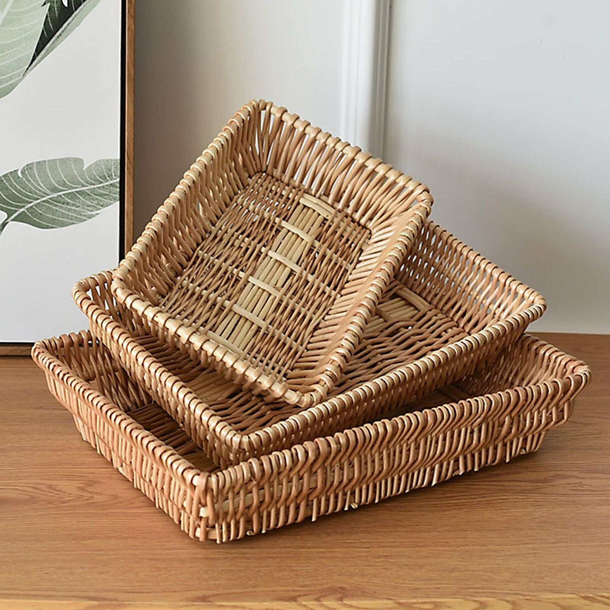 Rattan Storage Basket set with three stackable woven trays in natural tan rattan, featuring rounded corners and open tops