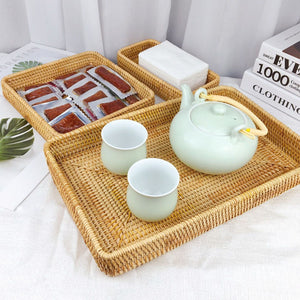 Rattan Tray Tabletop Organization features a natural golden woven tray with raised edges, holding pale green cups and teapot