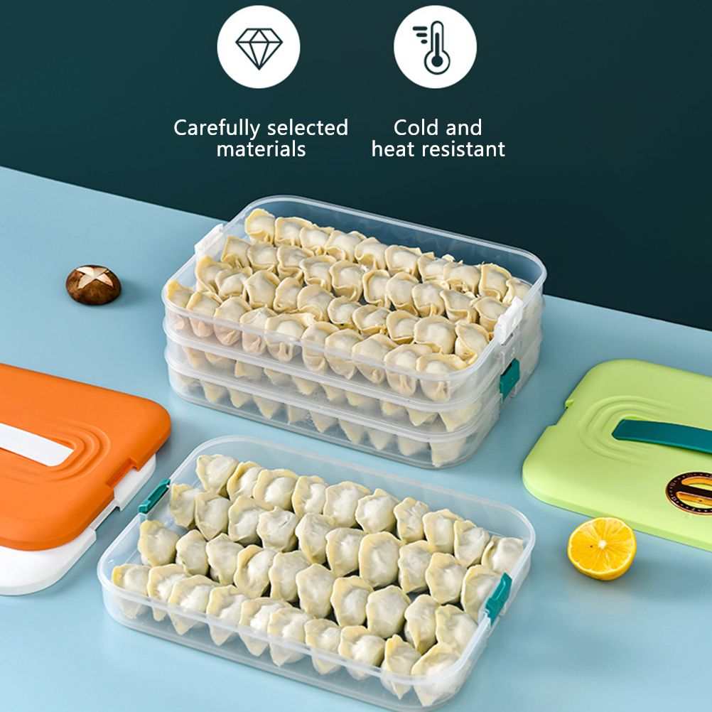Refrigerator Food Shelf storage box with three clear plastic layers of dumplings, teal clips and orange and green lids