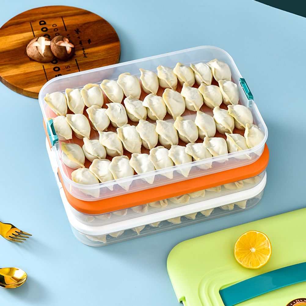 Stackable dumpling storage box with three clear plastic layers, white lids, orange divider, and transparent side clips; Refrigerator Food Shelf container