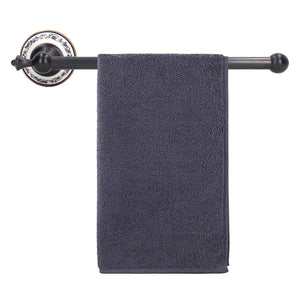 Retro Copper Bathroom towel bar with a dark bronze rod, blue and white porcelain mounting plate and charcoal towel