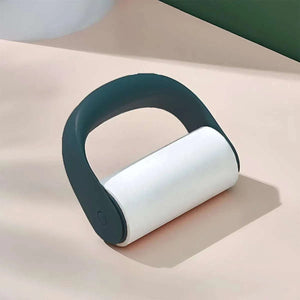 Reusable Lint Roller with a black handle and white adhesive roller designed for removing lint and pet hair