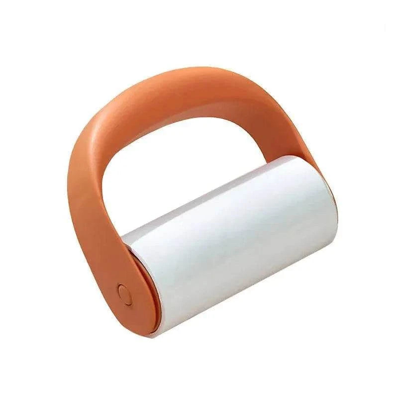 Reusable Lint Roller with orange plastic handle and white adhesive roller for removing lint and pet hair