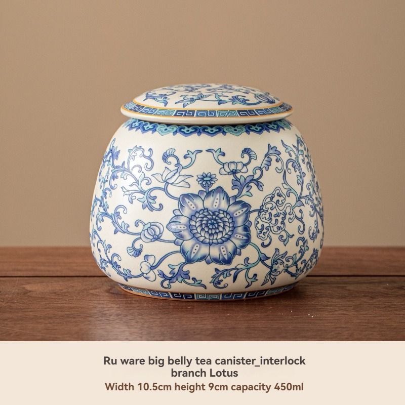 Ru Kiln tea jar in blue-and-white ceramic, with a rounded body, floral pattern and matching fitted lid