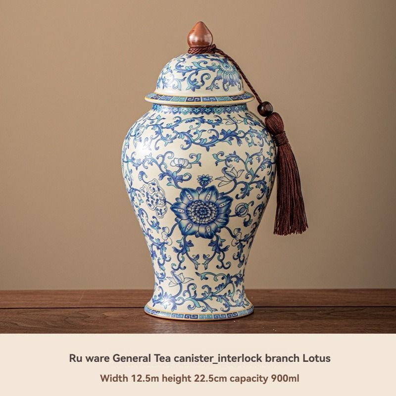 Ru Kiln tea jar, cream ceramic urn with dense blue floral and scrolling motifs, domed lid and tassel