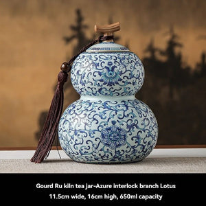 Ru Kiln tea jar in white ceramic with intricate blue floral scrollwork, double-gourd shape and wooden stopper lid