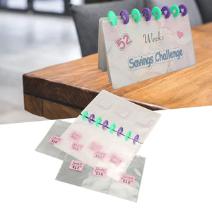Savings Binder 52 Week challenge book with translucent PVC pages, colorful binding discs, and pink labeled cash envelope pockets