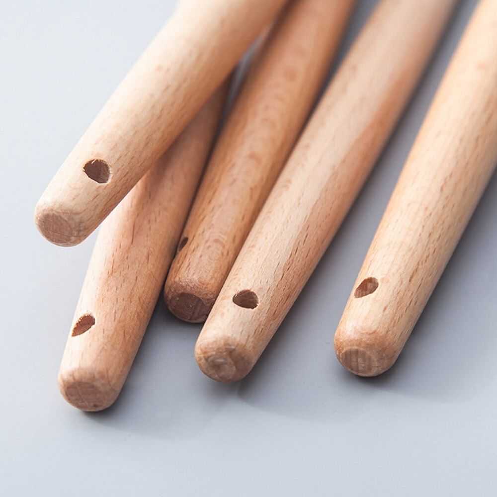 Silicone Kitchen Utensil with pale natural wood handles, rounded ends and small hanging holes; utensil heads are not visible.