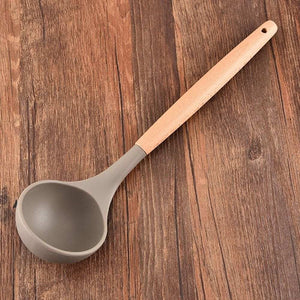 Silicone Kitchen Utensil soup ladle with a taupe silicone bowl and pale wooden handle with a hanging hole