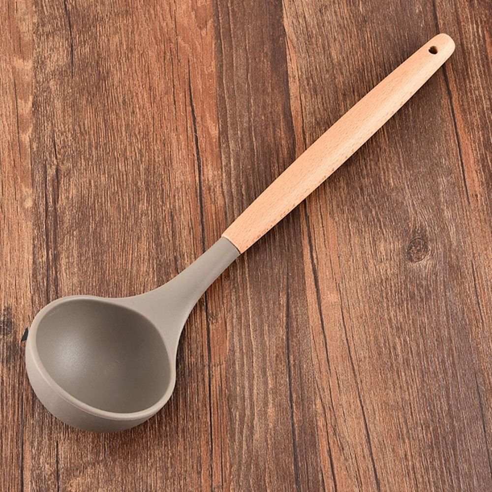 Silicone Kitchen Utensil soup ladle with a taupe silicone bowl and pale wooden handle with a hanging hole