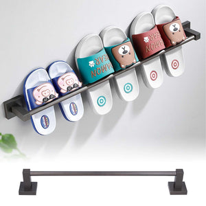 Slippers Rack Grey wall-mounted dark metal rail holding four pairs of white slippers with colorful cartoon straps