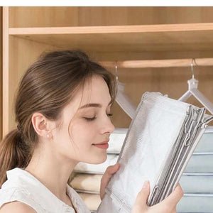 Spacious PVC Vertical Wardrobe organiser in pale grey, with layered hanging compartments and sturdy hooks for clothing storage