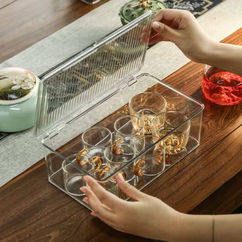 Stackable Organizer Bin Hinged Lid in clear plastic, shown open with gold-accented glass cups inside