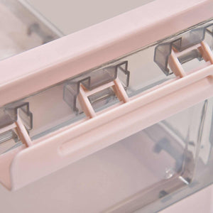 Stackable Storage Bin with a pink plastic frame, clear panels and hinged clips along the lid edge