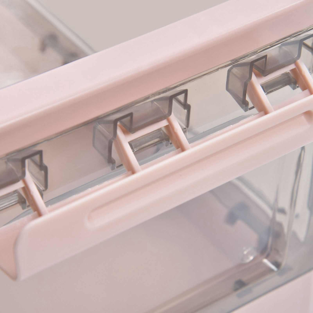 Stackable Storage Bin with a pink plastic frame, clear panels and hinged clips along the lid edge