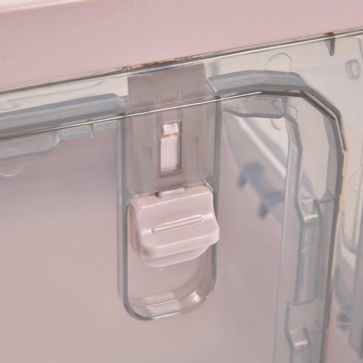 Stackable Storage Bin in translucent pink PP plastic, showing a close-up of its hinged lid latch and clear rim