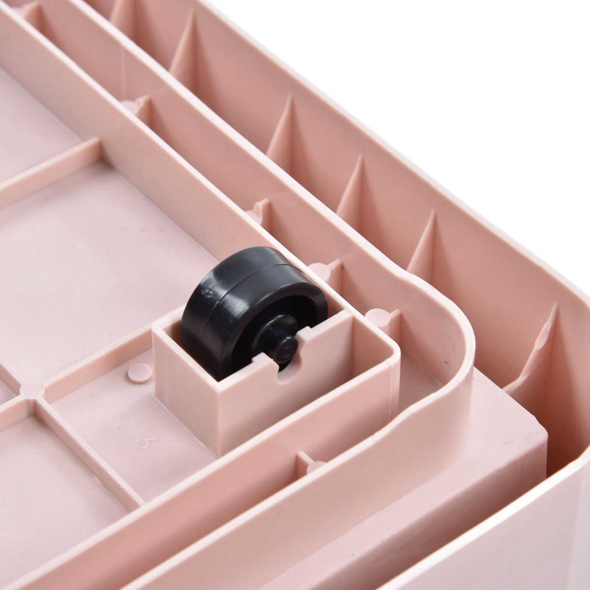 Stackable Storage Bin underside in pale pink PP plastic, showing a black removable wheel fitted into its molded corner socket