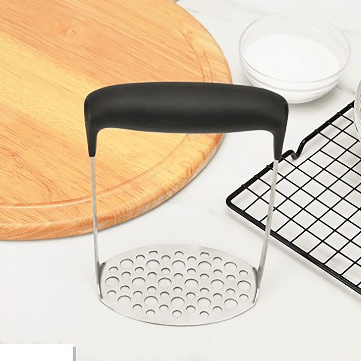 Stainless Steel Potato Masher with a perforated silver steel plate and wide black horizontal grip handle