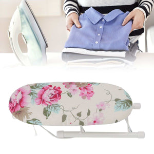 Tabletop Ironing Board with a cream fabric cover, pink peony and green leaf pattern, and white folding metal frame