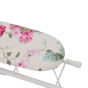 Tabletop Ironing Board with a cream fabric cover, pink peony flowers and green leaves on a white folding metal frame