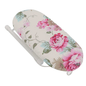 Tabletop Ironing Board with cream fabric cover, pink peony and green leaf print, and white folding metal legs