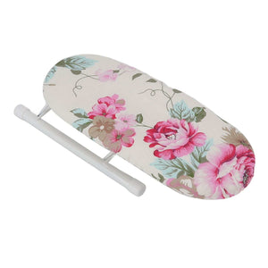 Tabletop Ironing Board with cream cloth cover, pink peony flowers and green leaves, supported by a white folding frame