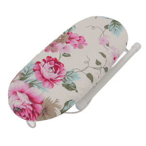 Tabletop Ironing Board with a cream fabric cover, pink peony floral pattern and foldable white metal frame