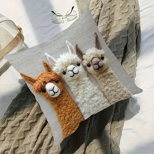 Cushion cover in grey linen blend with a textured print of three cream and brown alpaca friends, Vintage Alpaca Friends