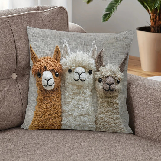 Vintage Alpaca Friends cushion cover in natural linen blend, featuring three fluffy alpacas in brown, white and cream