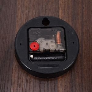Wood Wall Clock with a round black plastic rear casing, exposed quartz mechanism and visible battery compartment