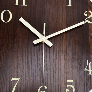 Wood Wall Clock with a dark brown wood-grain face, cream-colored numerals and pale hands in a frameless design